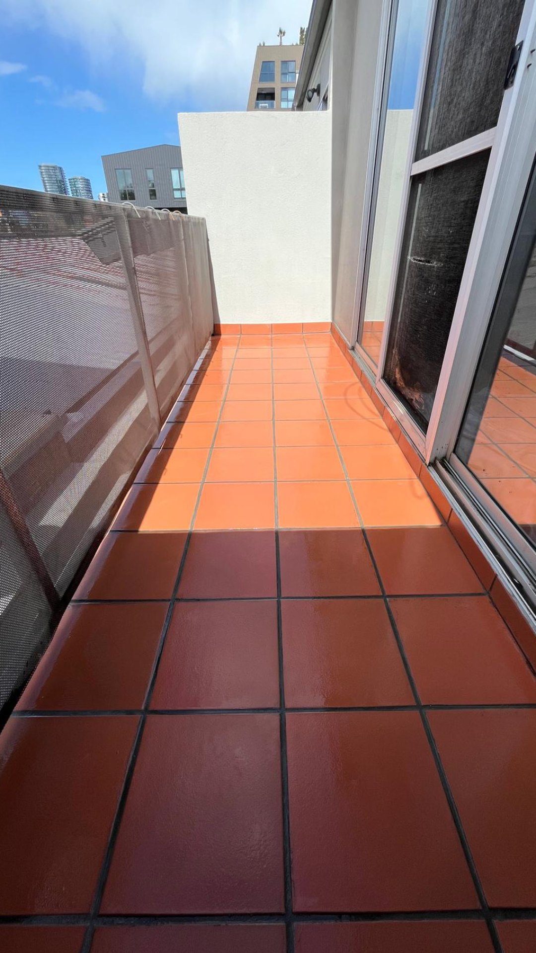 Tiled balcony after epoxy regrout and waterproofing