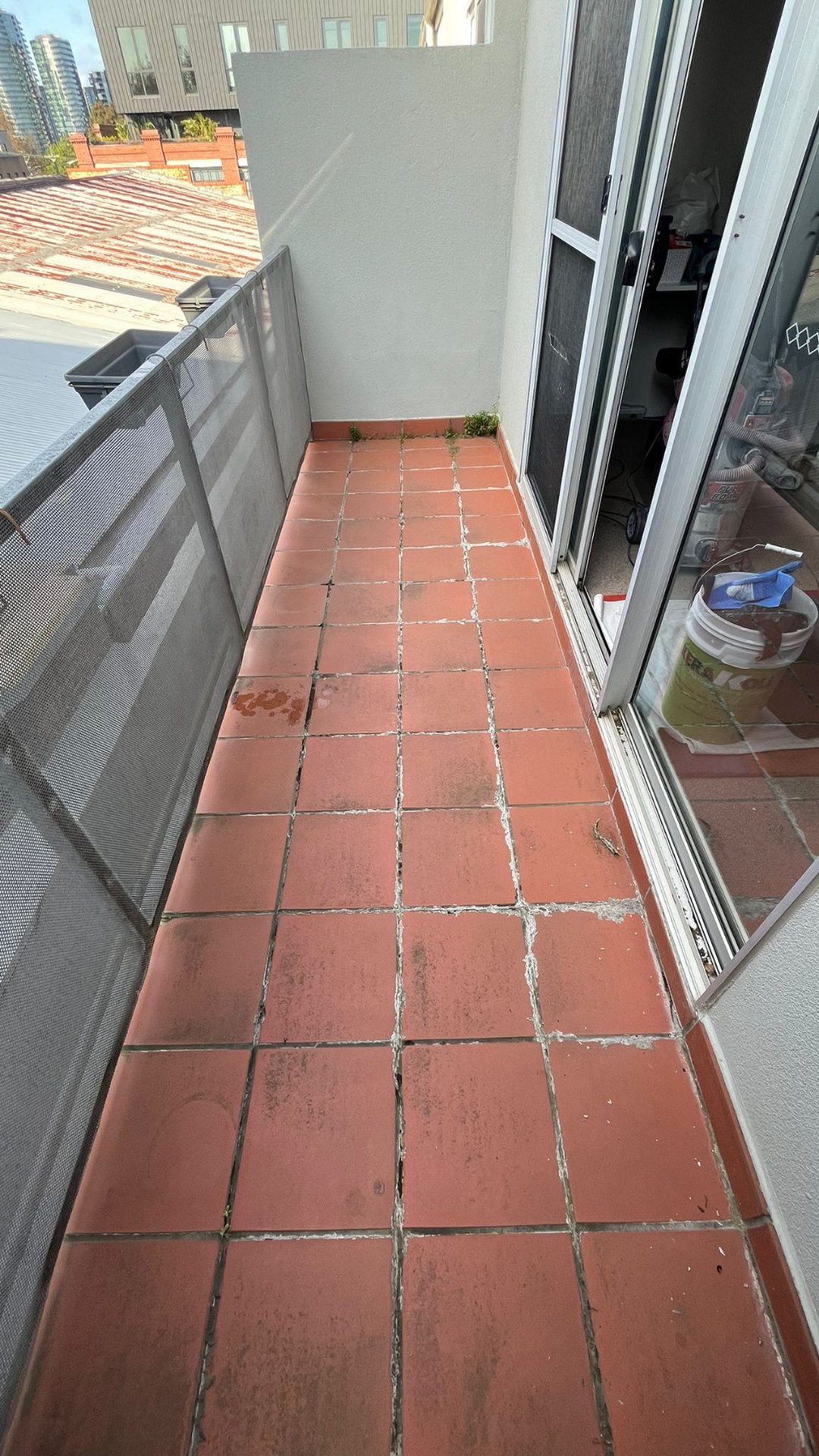 Leaking tiled balcony in Melbourne before epoxy regrout
