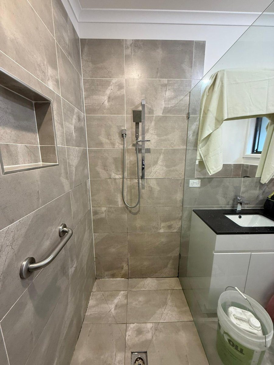 Mouldy shower grout before restoration